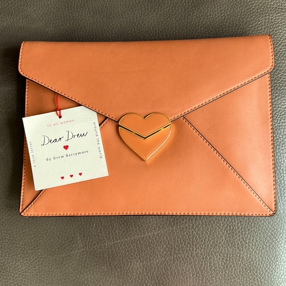 DREW Handbags - NWT - Drew Barrymore Heart Lock Envelope Clutch - Peach with gold.